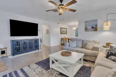 a living room with a couch and a tv at 7-Person Luxury Spa, Fenced Paradise, Beach Vibes in Pembroke Pines