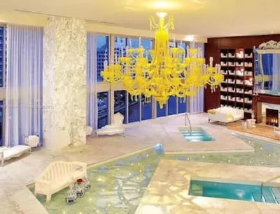 a large living room with a chandelier and a pool at 28th Floor Icon Brickell Penthouse with City Views in Miami