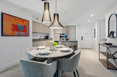 a kitchen and dining room with a table and chairs at Oceanview 2BR and luxury amenities at Hyde Beach House in Hollywood