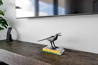 a statue of a bird sitting on a book at Oceanview 2BR and luxury amenities at Hyde Beach House in Hollywood