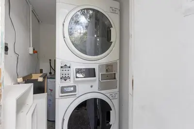 a washing machine in a room with a window at Lake Ridge Villa in Fort Lauderdale