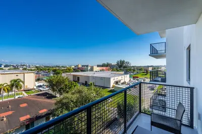 a balcony with a view of a city at Amazing 2 Bedroom Unit In Doral Miami With Free Parking in Hialeah Gardens