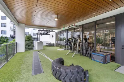 a gym with a tire on the floor of a building at Amazing 2 Bedroom Unit In Doral Miami With Free Parking in Hialeah Gardens