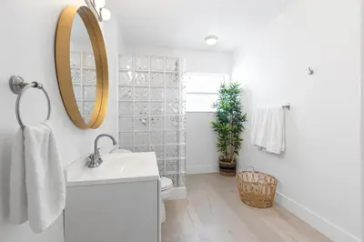 a bathroom with a sink and a mirror at Dreamy 1-bedroom apt walking distance to Las Olas in Fort Lauderdale