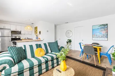 a living room with a couch and a table at Lovely 2 BR condo in Sailboat Bend in Fort Lauderdale