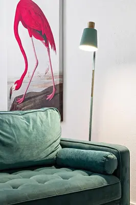 a pink flamingo sitting on top of a couch next to a lamp at Stylish 2 BR Condo - Free Parking on Premises in Fort Lauderdale