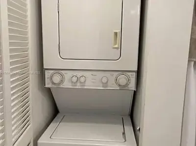 a small white refrigerator with its door open at Club at Brickell Bay Bayview Balcony 1BR Free Parking in Miami