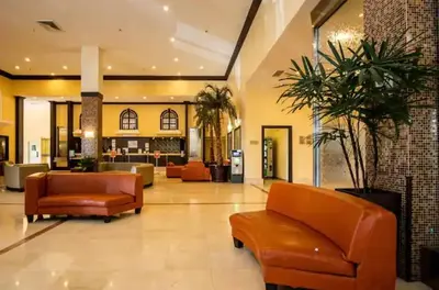 a lobby with couches and chairs in a building at Entire Condo in Sunny Isles in Sunny Isles Beach