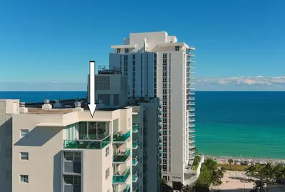 an aerial view of a tall building next to the ocean at LUXURY PENTHOUSE ON THE BEACH 3/3 OCEANFRONT CONDO in Hollywood