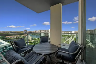 a table and chairs on a balcony with a view at Oceanfront Luxury Penthouse On The Beach 3 Bedroom in Hollywood