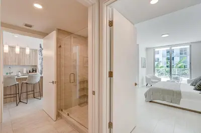a bedroom and bathroom with a shower and a bed at 3900-719JC DESIGN DISTRICT, CONDO 1 BEDROOM /1 BATHROOM & BAYVIE in Miami