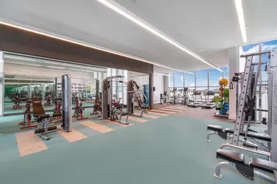 a gym with treadmills and machines in a building at 3900-902CH DESIGN DISTRICT, CONDO 2 BEDROOMS & 2 BATHROOMS in Miami
