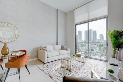 a living room with a white couch and a table at 3900-504MQ DESIGN DISTRICT, CONDO 1 BEDROOM & 1 BATHROOM in Miami