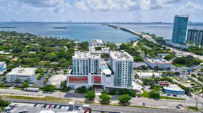 an aerial view of a city with a body of water at 3900-504MQ DESIGN DISTRICT, CONDO 1 BEDROOM & 1 BATHROOM in Miami