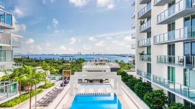 an aerial view of an apartment building with a swimming pool at 3900-504MQ DESIGN DISTRICT, CONDO 1 BEDROOM & 1 BATHROOM in Miami