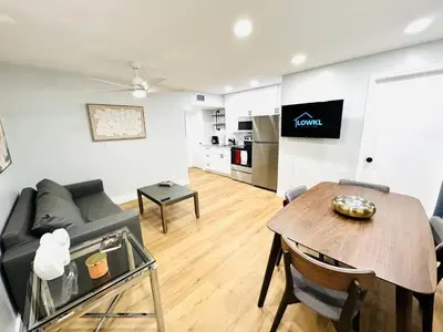 a living room with a couch and a table at Progresso Apartments & Homes by Lowkl in Fort Lauderdale