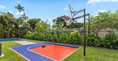 a basketball hoop with a ball on a basketball court at New Spectacular 6BR Bliss - Pool - Spa & Pickell in Miami