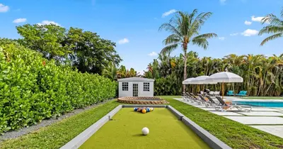 a backyard with a pool and a golf course at New Spectacular 6BR Bliss - Pool - Spa & Pickell in Miami