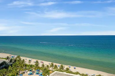 an aerial view of a beach with palm trees and the ocean at Tides in Hollywood Beach By My Miami Vacation in Hollywood