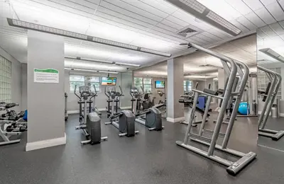 a gym with several treadmills and cardio machines at Tides in Hollywood Beach By My Miami Vacation in Hollywood