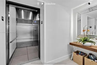 a walk in shower in a bathroom with a glass door at Apartment 3B/3B Bay View in Hallandale Beach