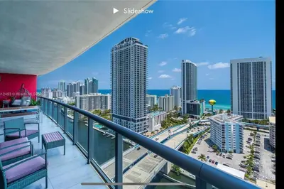 a balcony with a view of a city at Apartment 3B/3B Bay View in Hallandale Beach