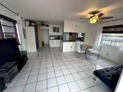 a living room with a couch and a kitchen at Beautiful Home in Florida in Hollywood