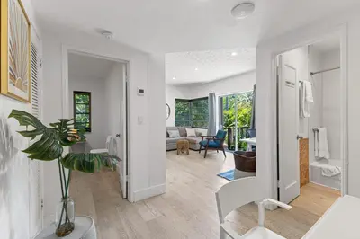 a living room with a couch and a table at Delight and cozy Apt close to Las Olas & the beach in Fort Lauderdale