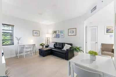 a living room with a couch and a table at Welcoming Airbnb Walkig distance to Las Olas Blvd in Fort Lauderdale