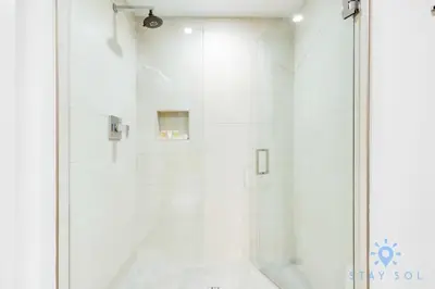 a shower with a glass door in a bathroom at Lovely Apt for 6 - Hollywood Beach Broad - walk in Hollywood