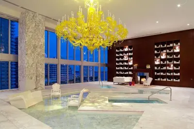 a large room with a chandelier in a building at Water & Pool Views, One bedroom W hotel building in Miami
