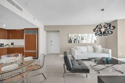 a living room with a couch and a table at Water & Pool Views, One bedroom W hotel building in Miami