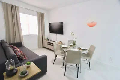 a living room with a couch and a table at BEAUTIFUL APARTMENT FOOTSTEPS FROM THE BEACH in Miami Beach