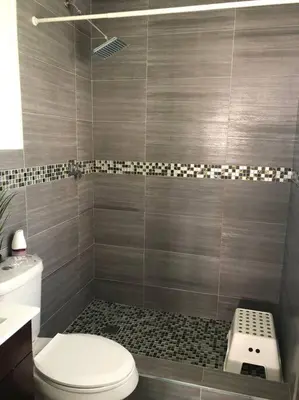 a bathroom with a toilet and a shower at MODERN AND ECLECTIC APARMENT A STEPS THE BEACH in Miami Beach
