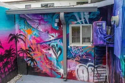 a building with a painting on the side of it at Cozy & Colorful Miami Art Canvas w/HotTub & Murals in Miami