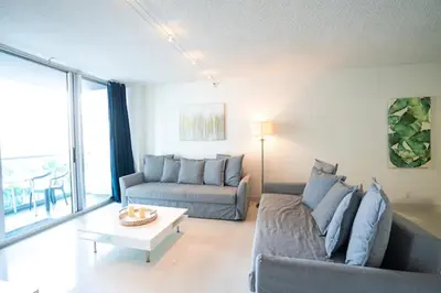 a living room with a couch and a table at SIAN private Apartments in Hollywood