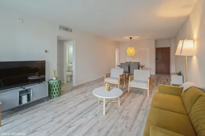 a living room with a couch and a table at SIAN private Apartments in Hollywood