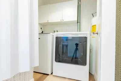 a television in a kitchen with a camera at Lakefront Villa and Paddle Board TGH in Miami