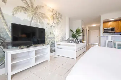 a living room with a large flat screen tv at Vista Mar: Bay Views Close to Miami Attractions in Miami Beach
