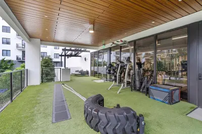 a gym with a large tire on the floor of a building at Modern 1 Bed in Downtown Doral With Free Parking in Hialeah Gardens
