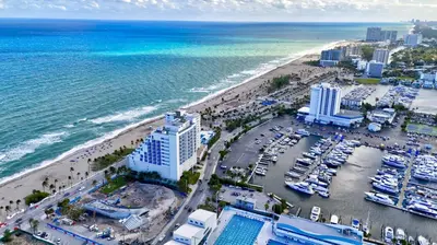 an aerial view of a beach and the ocean at Condo Right off Las Olas - Steps to FTL Beach 2A in Fort Lauderdale
