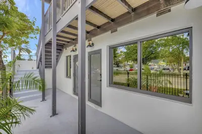 an exterior view of a building with large windows at Condo Right off Las Olas Steps to FTL Beach 1A in Fort Lauderdale