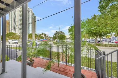 a view from a balcony of a street with cars at 2 Condo Combo Walk to Beach Off Las Olas 2AB in Fort Lauderdale