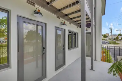 a row of sliding glass doors on a building at Studio Right off Las Olas - Steps to FTL Beach 2C in Fort Lauderdale