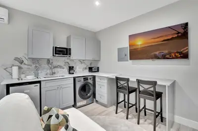 a kitchen with a sink and a washing machine at Studio Right off Las Olas - Steps to FTL Beach 2C in Fort Lauderdale