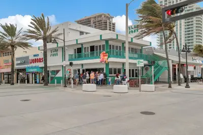a group of people standing in front of a building at Studio Right off Las Olas - Steps to FTL Beach 2B in Fort Lauderdale
