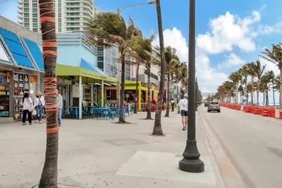a street with palm trees on a city street at Studio Right off Las Olas - Steps to FTL Beach 1B in Fort Lauderdale