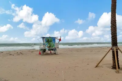 a lifeguard stand on a beach with the ocean at Lux Villa 3br 2ba off Las Olas in Fort Lauderdale