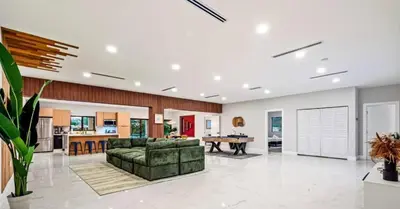 a large living room with a couch and a table at Sunny Isles Beach Luxury Property by Glam Homes in Miami