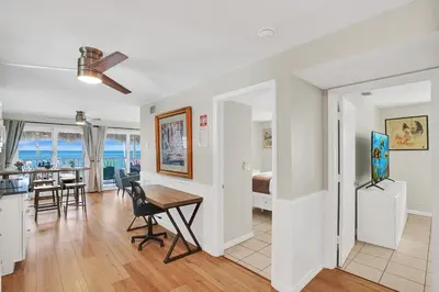 a living room and dining room with a table and chairs at Beach Condo - Hollywood Beachfront and Broadwalk in Hollywood